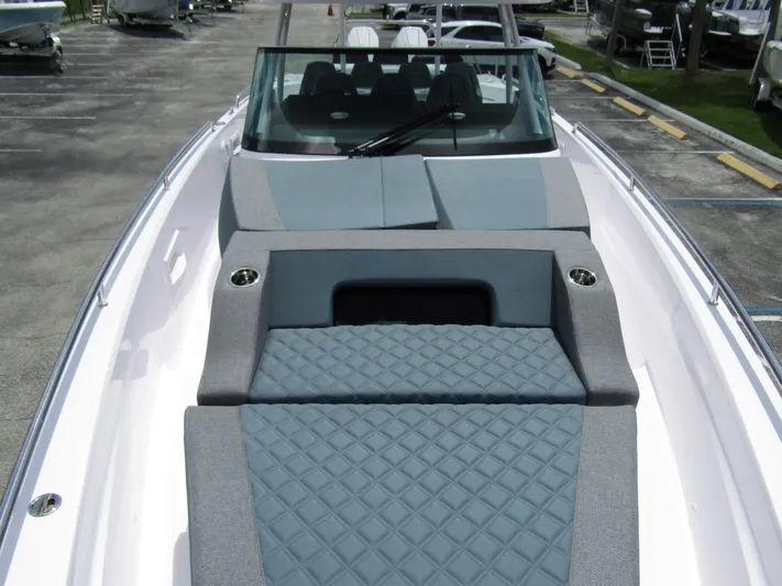  Yacht Photos Pics 2024 Axopar 37 Sun Top boat with sleek design and comfortable seating.