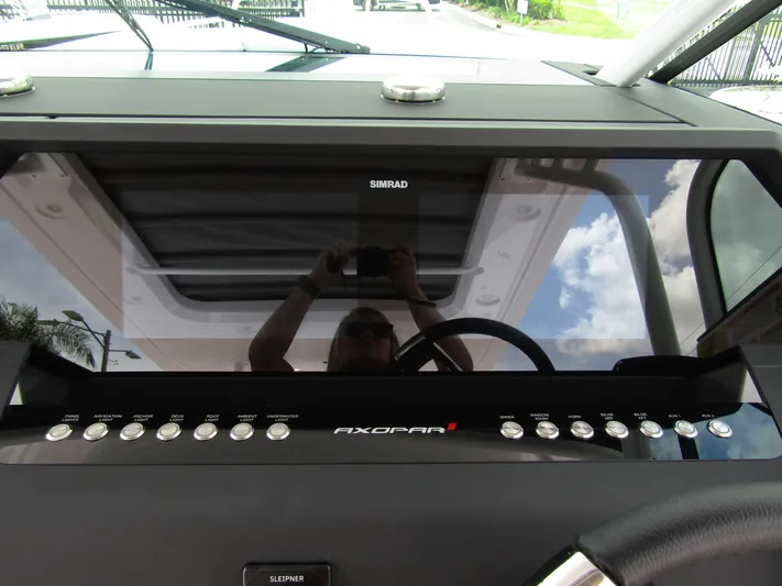  Yacht Photos Pics 2024 Axopar 37 Sun Top dashboard with Simrad display and control buttons.