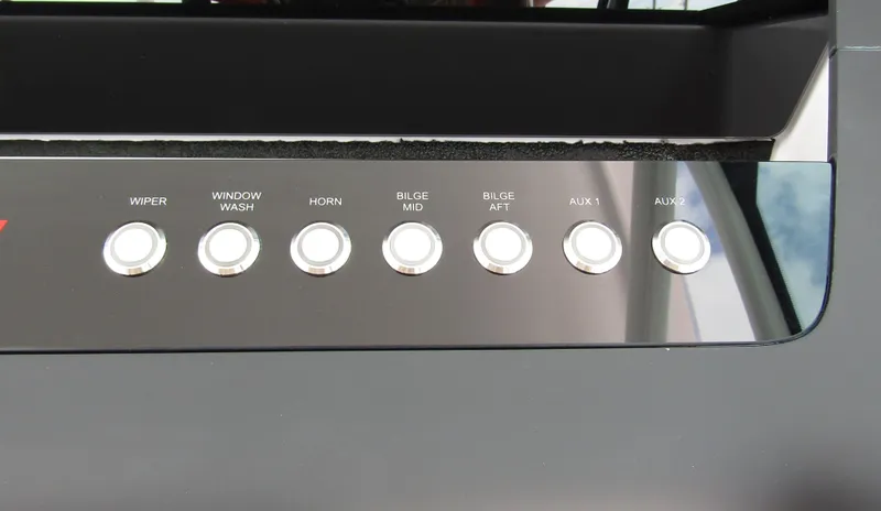  Yacht Photos Pics Control panel of 2024 Axopar 37 Sun Top with labeled buttons.