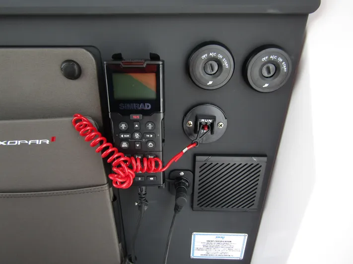  Yacht Photos Pics 2024 Axopar 37 Sun Top dashboard with controls and communication device.