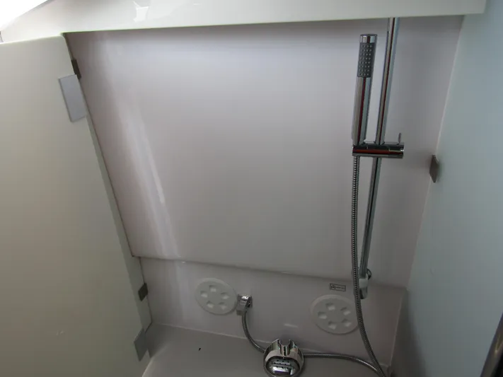  Yacht Photos Pics Shower area in 2024 Axopar 37 Sun Top boat, featuring modern fixtures.