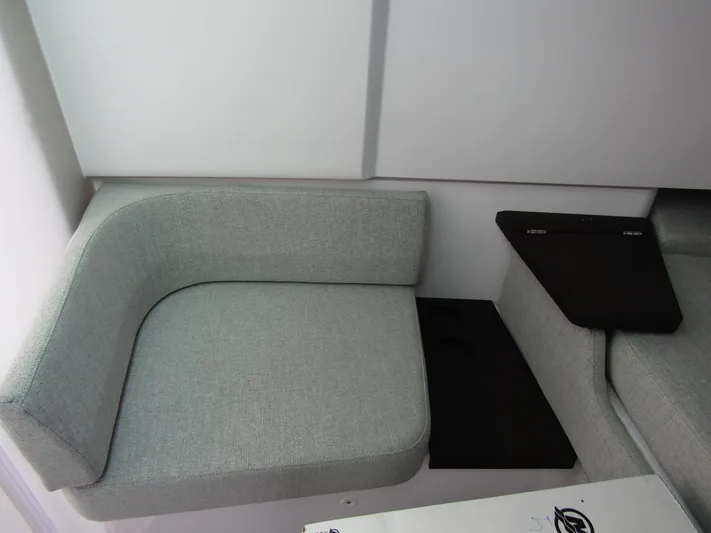  Yacht Photos Pics 2024 Axopar 37 Sun Top interior seating with modern gray upholstery.