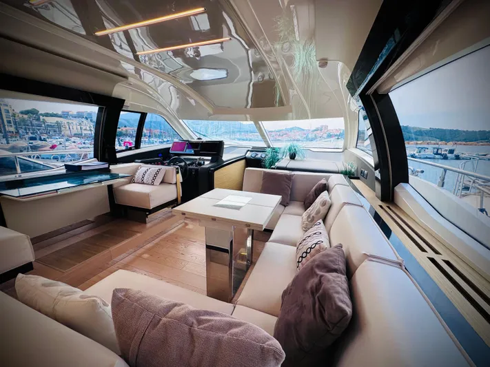  Yacht Photos Pics Luxurious interior of 2016 Ferretti Yachts 550 with elegant seating and panoramic windows.