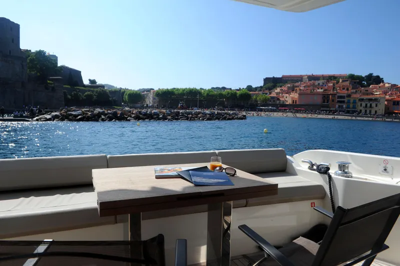  Yacht Photos Pics Luxurious 2016 Ferretti Yachts 550 with scenic waterfront view and elegant outdoor seating.