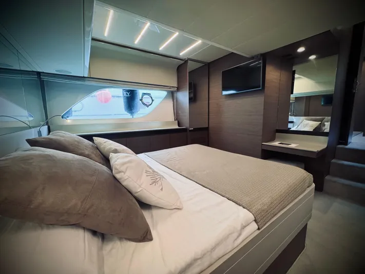  Yacht Photos Pics Luxurious bedroom interior of 2016 Ferretti Yachts 550 with modern design and elegant furnishings.