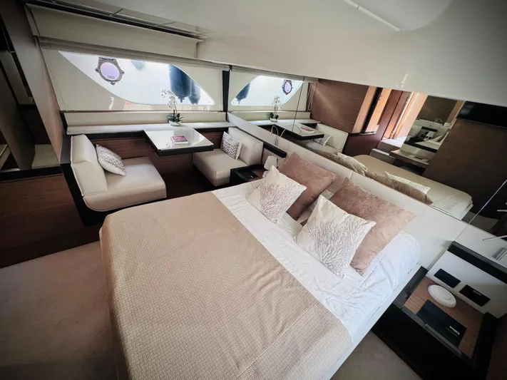  Yacht Photos Pics Luxurious interior of 2016 Ferretti Yachts 550 with elegant bedroom and seating area.