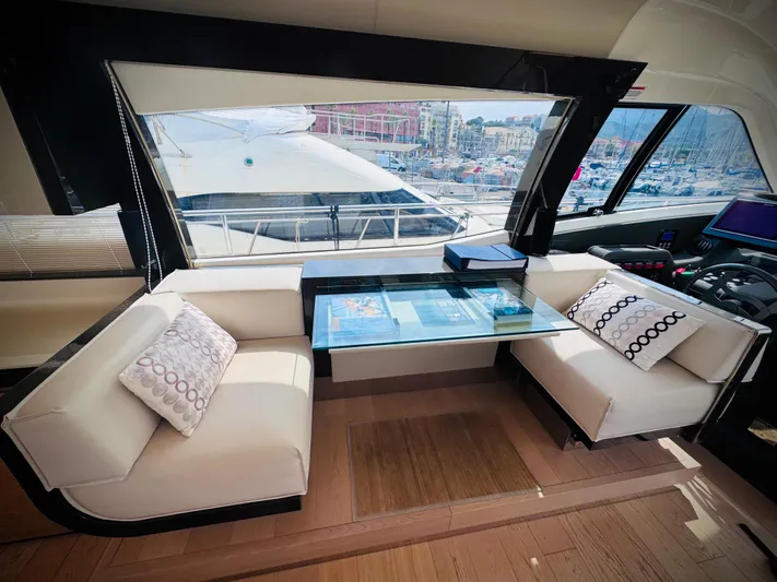  Yacht Photos Pics Luxurious interior of 2016 Ferretti Yachts 550 with elegant seating and panoramic windows.