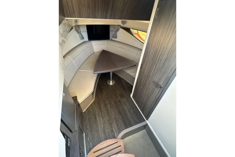  Yacht Photos Pics 2020 Sea Ray Sundancer 320 cabin interior with seating and table.