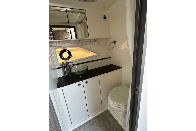  Yacht Photos Pics Modern bathroom in 2020 Sea Ray Sundancer 320 yacht with sleek fixtures and glass sink.