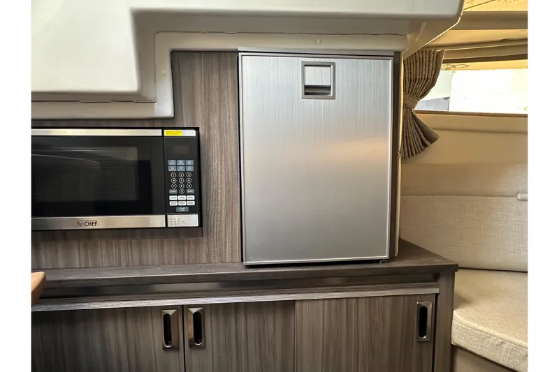  Yacht Photos Pics 2020 Sea Ray Sundancer 320 interior with microwave and compact fridge.