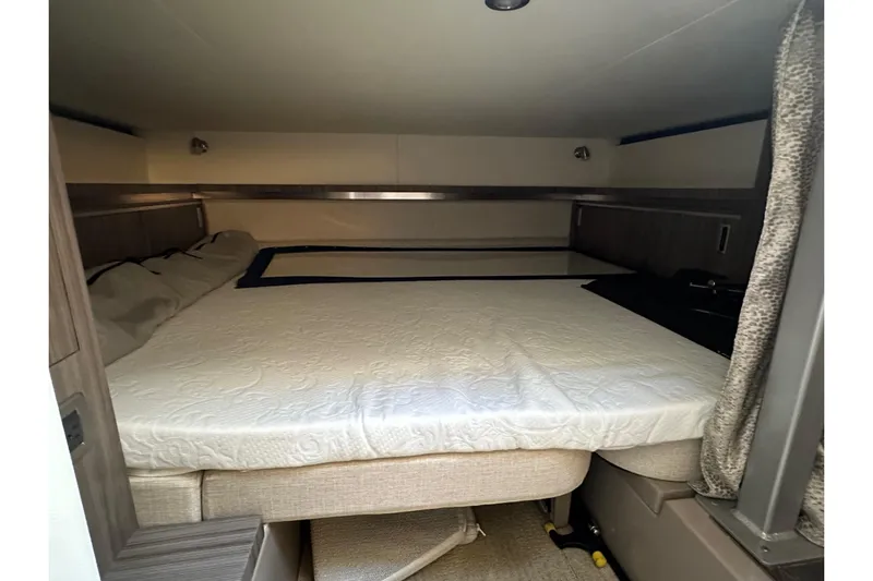  Yacht Photos Pics 2020 Sea Ray Sundancer 320 cabin interior with cozy bed and modern design.