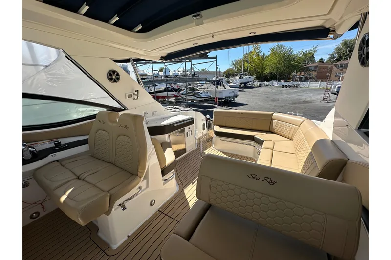  Yacht Photos Pics 2020 Sea Ray Sundancer 320 interior with beige seating and modern design.