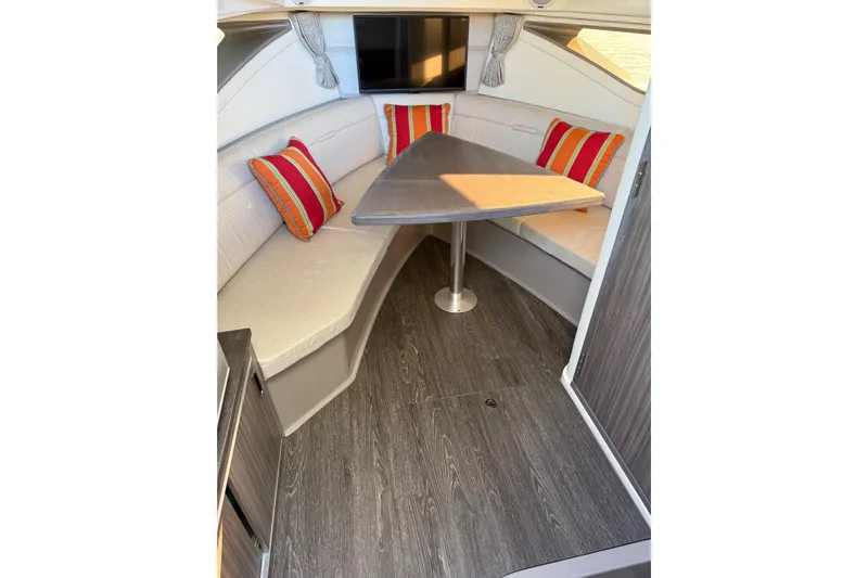  Yacht Photos Pics 2020 Sea Ray Sundancer 320 cabin interior with cozy seating and vibrant cushions.
