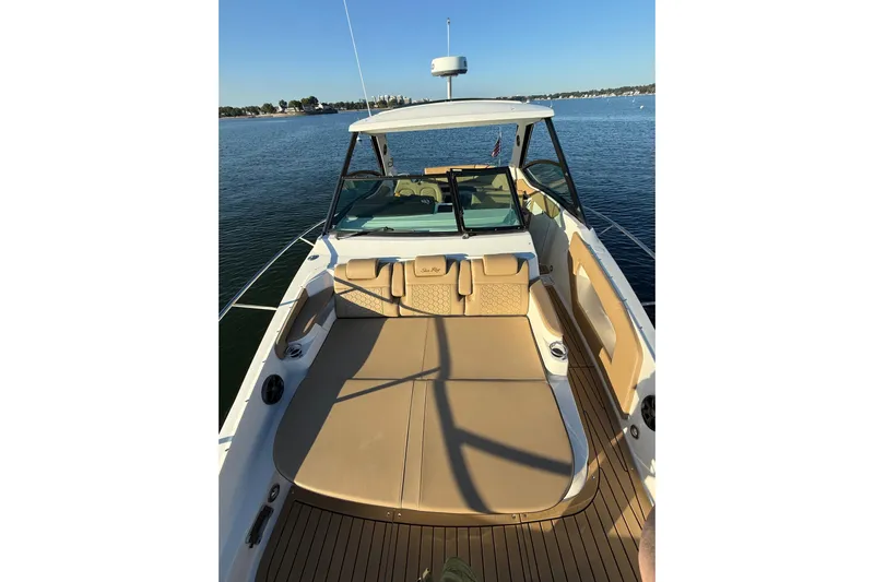  Yacht Photos Pics 2020 Sea Ray Sundancer 320 boat with spacious deck, cruising on calm waters.