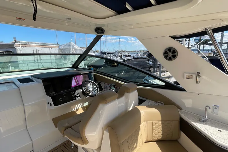  Yacht Photos Pics Interior of 2020 Sea Ray Sundancer 320 yacht with helm and seating area.