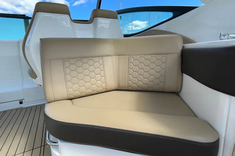  Yacht Photos Pics Luxurious seating on 2020 Sea Ray Sundancer 320 boat with beige upholstery and hexagonal pattern.