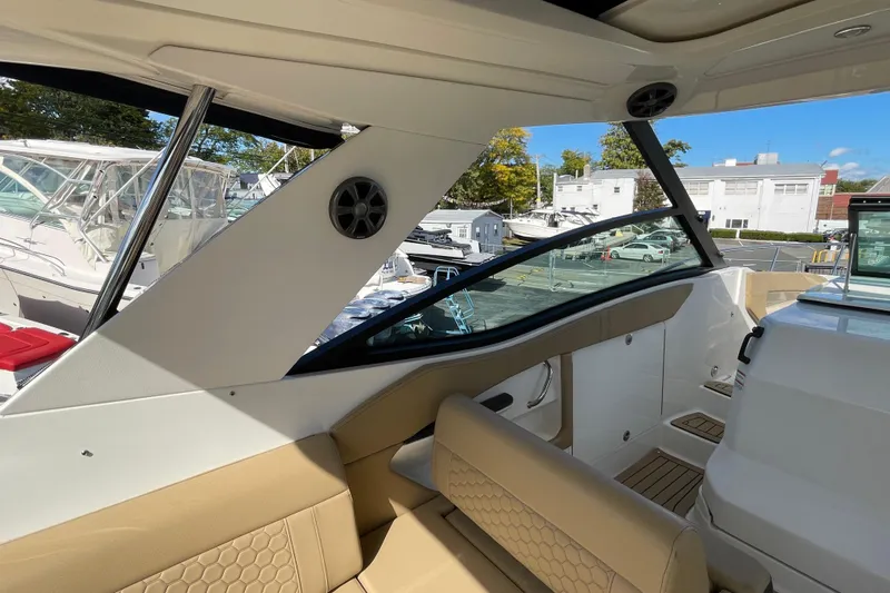  Yacht Photos Pics 2020 Sea Ray Sundancer 320 interior with beige seating and modern design.