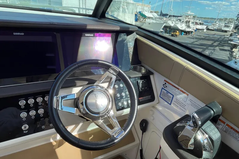  Yacht Photos Pics 2020 Sea Ray Sundancer 320 helm with steering wheel and control panel.