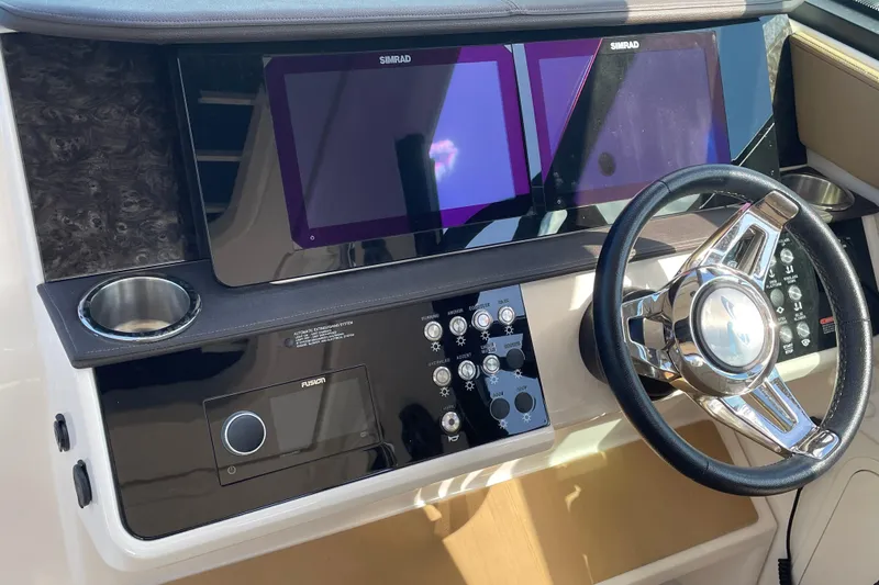 Yacht Photos Pics 2020 Sea Ray Sundancer 320 helm with dual Simrad displays and modern controls.