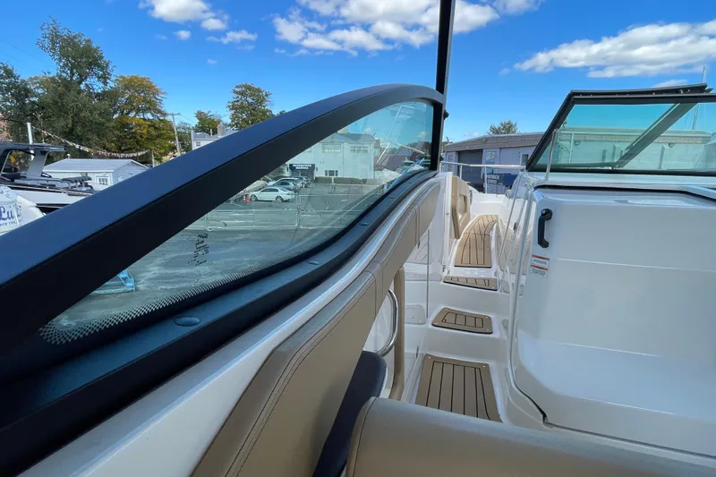  Yacht Photos Pics 2020 Sea Ray Sundancer 320 boat interior with sleek design and clear blue sky.