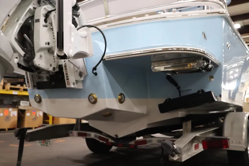  Yacht Photos Pics 2024 SeaCraft 23CC boat rear view on trailer in warehouse.