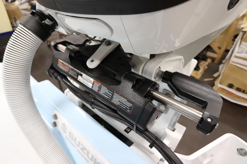  Yacht Photos Pics 2024 SeaCraft 23CC boat engine detail with Suzuki components and hydraulic system.