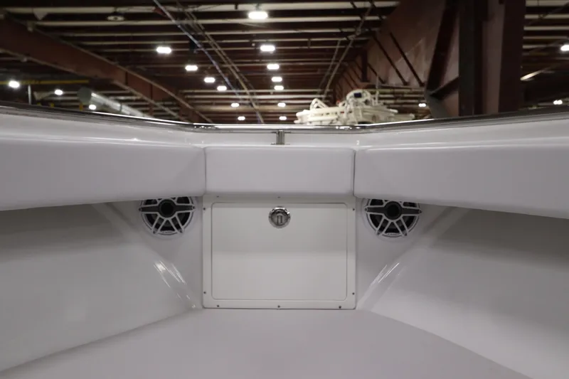  Yacht Photos Pics 2024 SeaCraft 23CC boat interior with speakers and storage compartment.