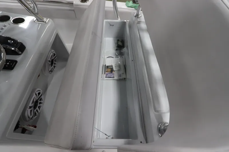  Yacht Photos Pics 2024 SeaCraft 23CC boat interior with storage compartment and control panel.