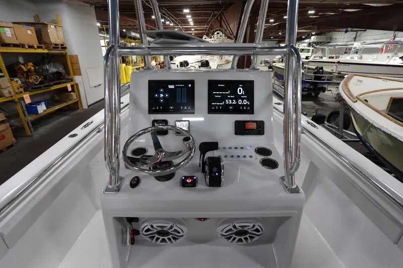  Yacht Photos Pics 2024 SeaCraft 23CC boat console with modern controls and digital displays in a showroom.