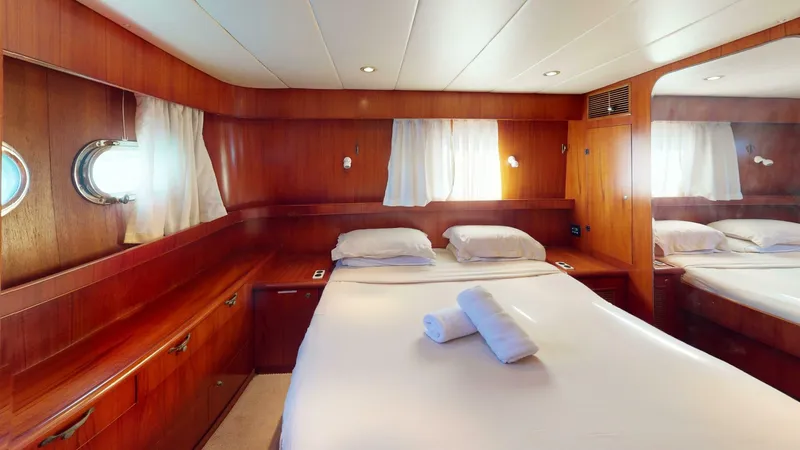 Aurora Of St.vincent Yacht Photos Pics Luxurious cabin interior of 2000 Horizon 48 yacht with wooden finish and cozy bed.