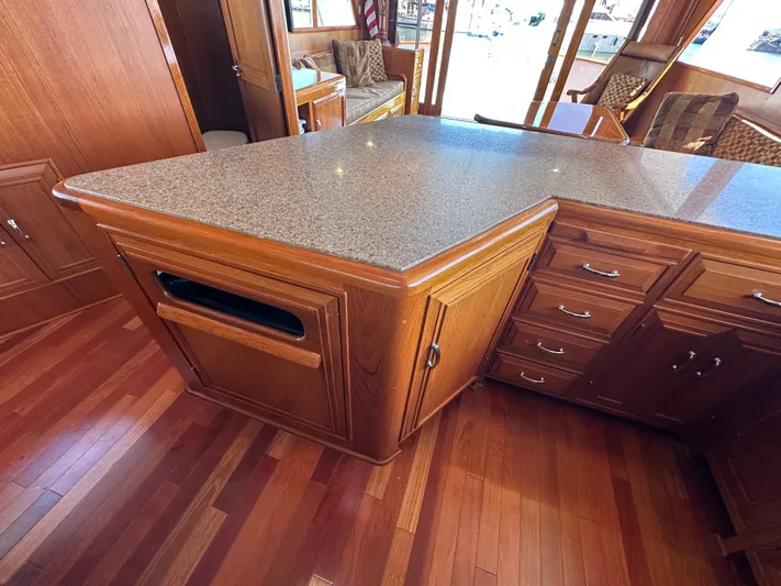  Yacht Photos Pics 1985 Ocean Alexander Pilothouse interior with wooden cabinetry and granite countertop.