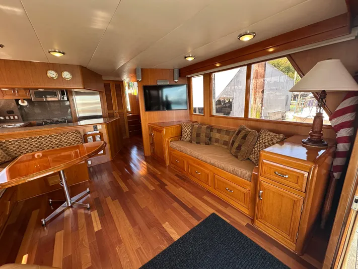  Yacht Photos Pics Luxurious 1985 Ocean Alexander Pilothouse interior with wood finishes and modern amenities.