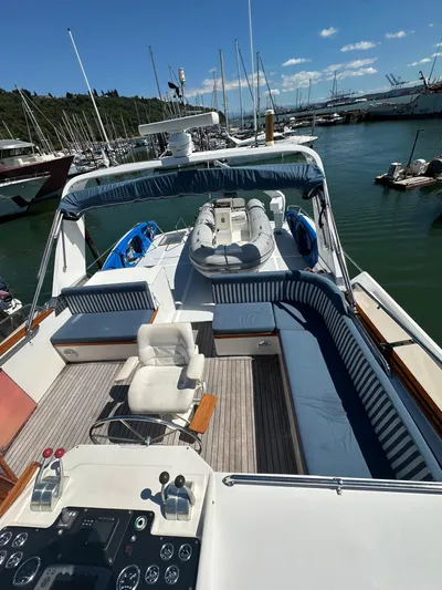  Yacht Photos Pics 1985 Ocean Alexander Pilothouse yacht with spacious deck and seating at marina.
