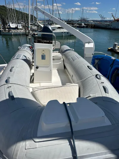  Yacht Photos Pics Inflatable boat on Ocean Alexander Pilothouse 1985, docked in marina under clear sky.