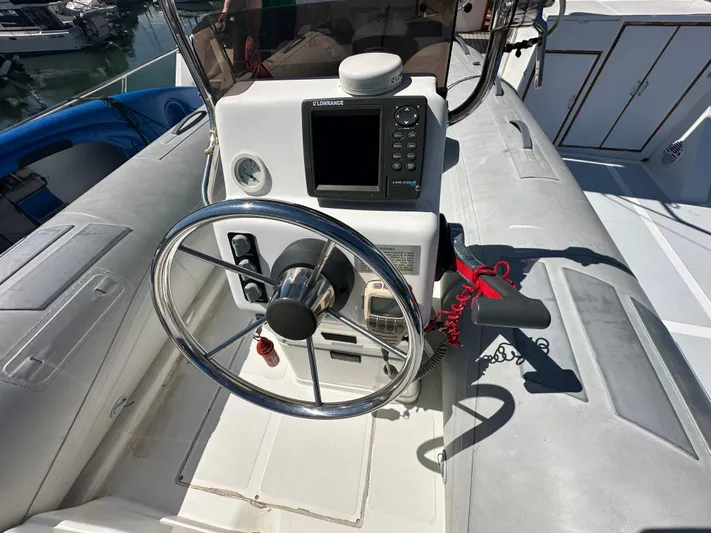  Yacht Photos Pics 1985 Ocean Alexander Pilothouse helm with steering wheel and navigation equipment.