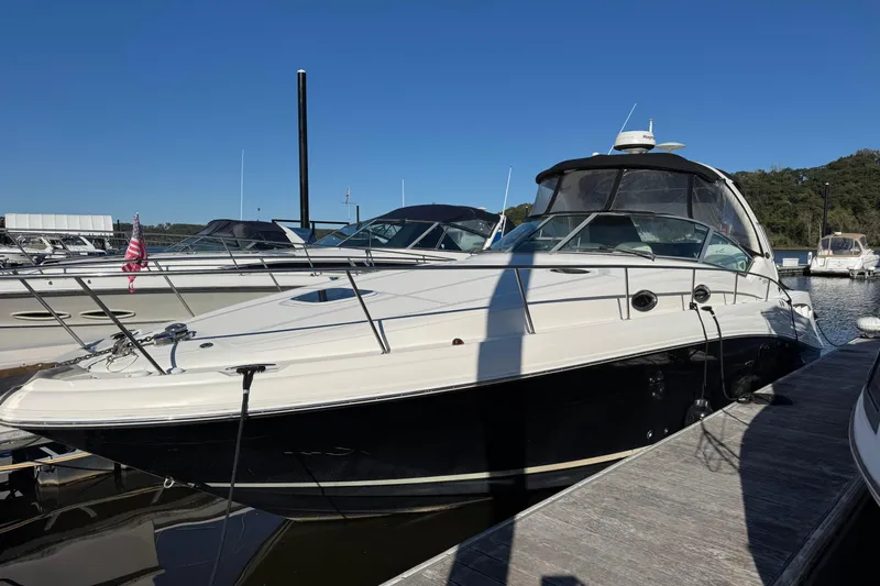  Yacht Photos Pics 2007 Sea Ray 340 Sundancer docked at marina under clear blue sky.