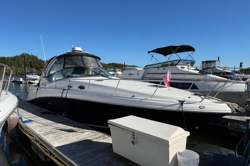  Yacht Photos Pics 2007 Sea Ray 340 Sundancer docked at marina under clear blue sky.