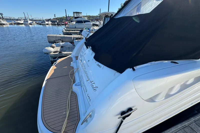  Yacht Photos Pics 2007 Sea Ray 340 Sundancer docked at marina, rear view with black cover.