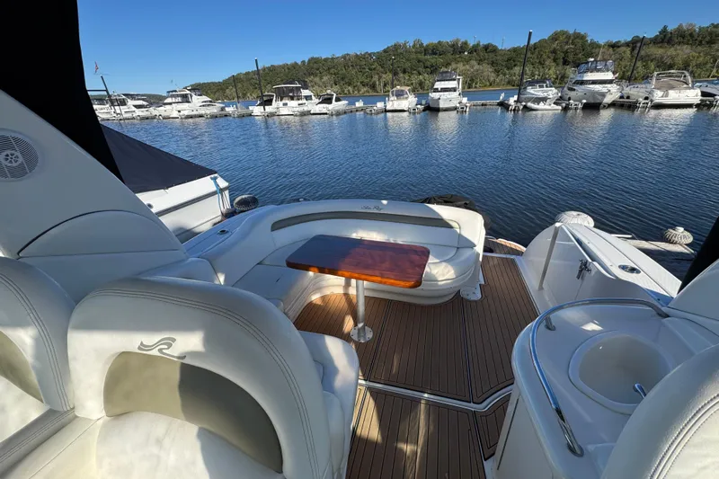  Yacht Photos Pics 2007 Sea Ray 340 Sundancer yacht interior with seating and table, docked at marina.