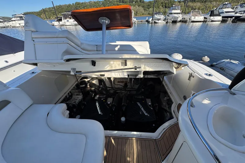  Yacht Photos Pics 2007 Sea Ray 340 Sundancer engine compartment open, showcasing dual Mercury engines at marina.