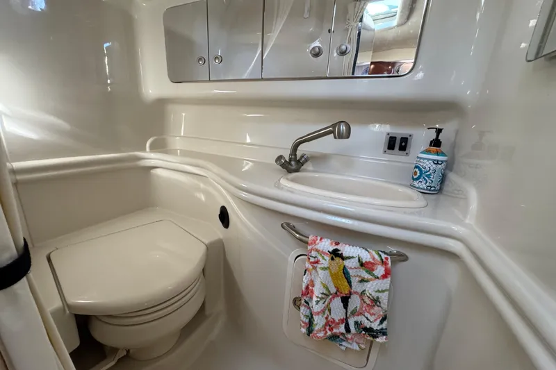  Yacht Photos Pics 2007 Sea Ray 340 Sundancer bathroom with sink, mirror, and toilet.