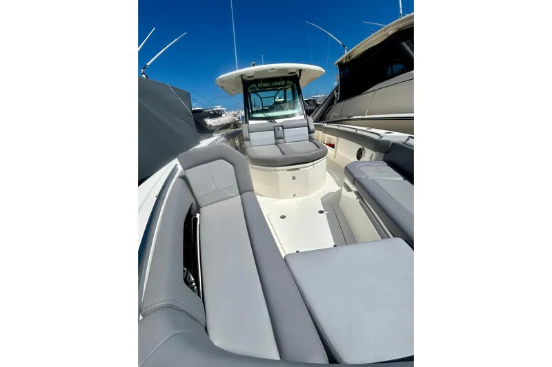  Yacht Photos Pics 2023 Boston Whaler 360 Outrage boat interior with sleek seating and modern design.