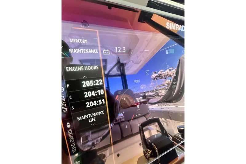 Yacht Photos Pics Dashboard of 2023 Boston Whaler 360 Outrage showing engine hours and maintenance data.