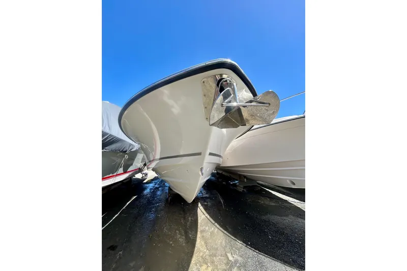  Yacht Photos Pics 2023 Boston Whaler 360 Outrage boat bow with anchor under clear blue sky.