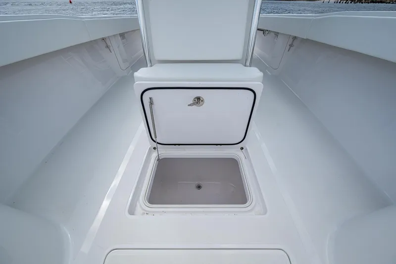 It's Time Yacht Photos Pics Open storage compartment on 2015 Bahama 41 boat deck, showcasing spacious interior.
