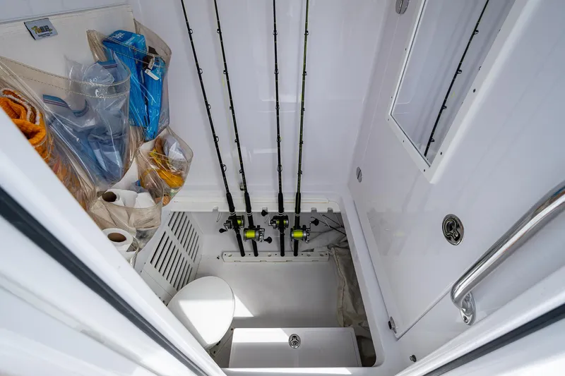 It's Time Yacht Photos Pics 2015 Bahama 41 boat storage area with fishing rods and gear.