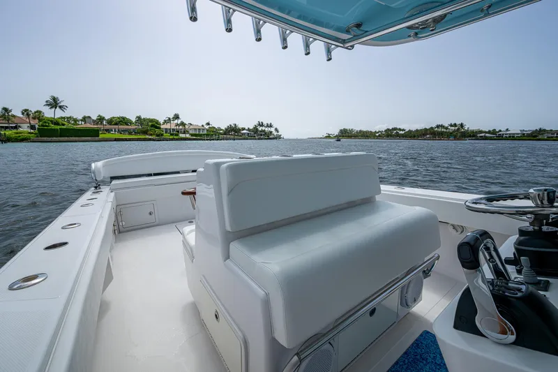 It's Time Yacht Photos Pics 2015 Bahama 41 boat interior with white seating, overlooking a serene waterfront view.