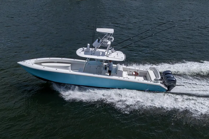 It's Time Yacht Photos Pics 2015 Bahama 41 boat cruising on water with triple outboard engines.