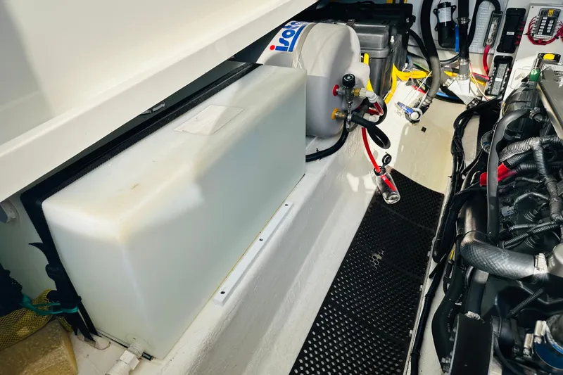 Watermark Yacht Photos Pics Engine compartment of a 2017 Back Cove 32 boat, showcasing mechanical components and wiring.