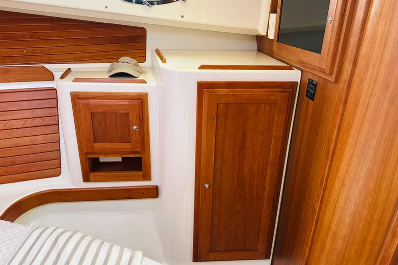 Watermark Yacht Photos Pics 2017 Back Cove 32 interior with wooden cabinetry and storage compartments.